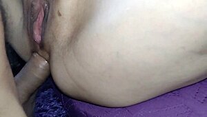 She's spreading her pussy while getting fucked in the ass