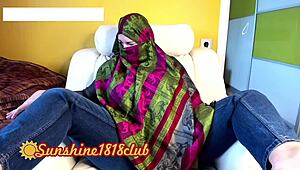 Chatting about Arab hijab babe rubbing her jeans-clad ass on cam