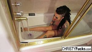 christy mack bathes solo in makeup room, masturbating with big tits