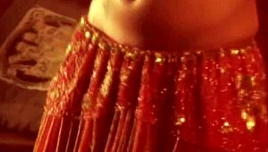 Wow, check this sexy brunette babe shaking her belly in a hot dance!