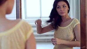 Dark haired teen's natural tits and hairless pussy on display