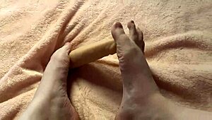 Cute and sexy amateur with sex toy gives slow foot job