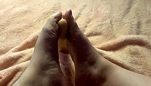 Cute and sexy amateur with sex toy gives slow foot job