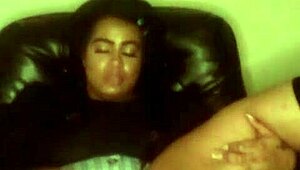 Watch this busty ebony milf play with her pussy