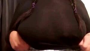 Watch this busty ebony milf play with her pussy