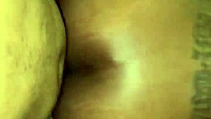 Mulla's back is bent over as she receives a big black cock