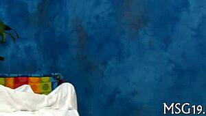 Cute masseuse gives a relaxing body show in a spa setting