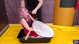 Piss-covered submissive deepthroats dominantly in domination.