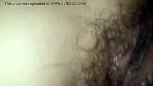 The white girl wearing a red hat and yellow outfit is observed by a voyeur