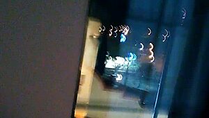 Sexy MILF flashes by the hotel window