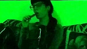 Hungarian goth mistress smokes in green light setting