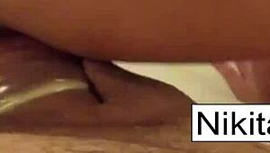 Watch Nikita's Footjob and Titty Fuck!
