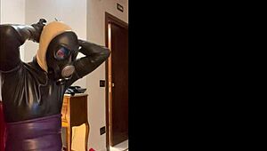 Wearing a tight gas mask for intense latex-rubber fetish play