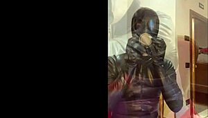 Wearing a tight gas mask for intense latex-rubber fetish play