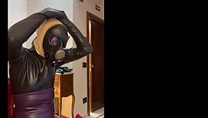 Wearing a tight gas mask for intense latex-rubber fetish play