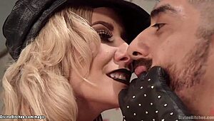 In the dimly lit dungeon, a dominant blonde femdom relentlessly fucks her bound man in a straight jacket, exploring bizarre domination and deepthroat bondage.