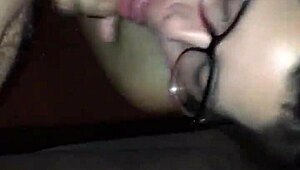 Sexy girl in glasses giving an amazing blowjob to a hard cock