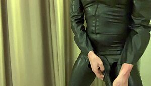 wearing a latex sheath over the penis extension for kinky fun