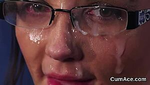 Nasty doll receives cumshot on face while eating jism