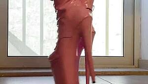 walking tall in pink boots a captivating vision of domination and heels on her ass