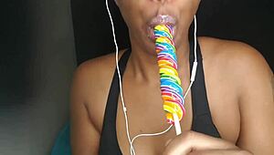 Cute ebony chick sucking lollipop with a naughty twist 😏