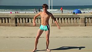 Man, I’m just lovin’ watchin’ this twink dancin’ at the beach with that speedo bulge!