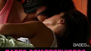 two beautiful brunettes make love by the fire