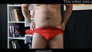 Muscular gay bear poses confidently