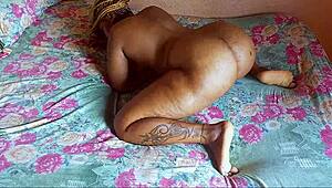 African babe pleases herself with her fingers