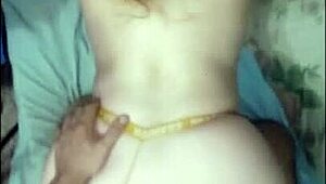 She's bent over in her yellow thong, taking it doggystyle.