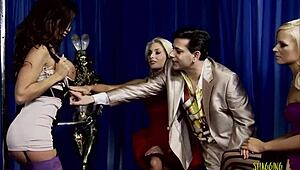 blonde milf strippers with fake boobs get too aroused and have group sex that ends with a facial?