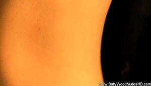 she's a sexy bollywood brunette dancer, stripping and teasing.