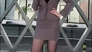 Hey, check out this office lady in black stockings showing off her sexy legs at work. She’s driving everyone crazy today.