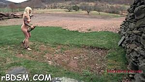 Caged brunette slave gives blowjob with toys