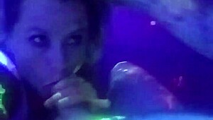 Husband and wife enjoy a wedding night blowjob in black light
