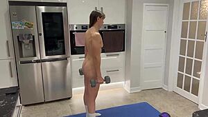 Athletic woman performs nude workout session