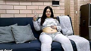 Lazy chubby brunette lounges at home