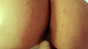 Woman Plays with Strapon Toy