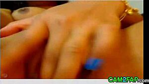 Asian webcam girl fingers pussy and anal for intense play