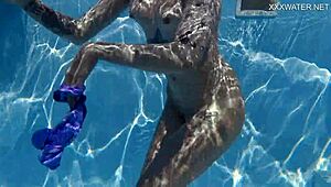 Gorgeous Mimi Cica enjoys a nude swim outdoors
