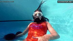 amelie bruna masturbates underwater in the pool, her nude body glistening