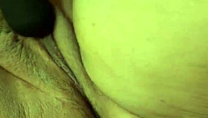 bbw plays with her pussy using a toy and squirts