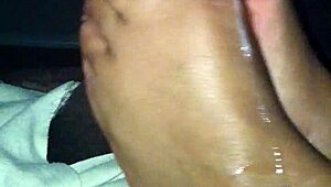 ebony babe gives a footjob in this amateur mov