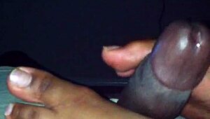 ebony babe gives a footjob in this amateur mov