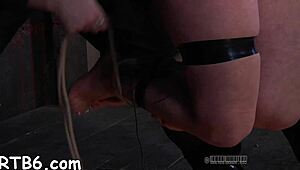 Taming a leather pet with blowjob and bound sex.