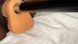 American woman squirts while using pussy fucking machine