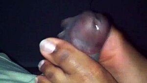 ebony babe gives a footjob in this amateur mov