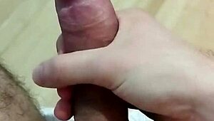 Young amateur strokes his cock for pleasure