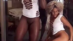 Two hot Brazilian lesbians dance and flash their sticky pussies on New Year's.