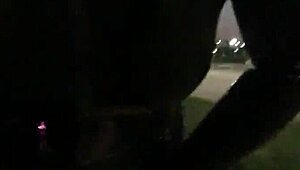 cd in latex walks outdoors with vibrator attached